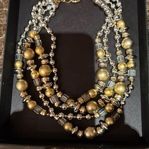 Four strand necklace with clasp